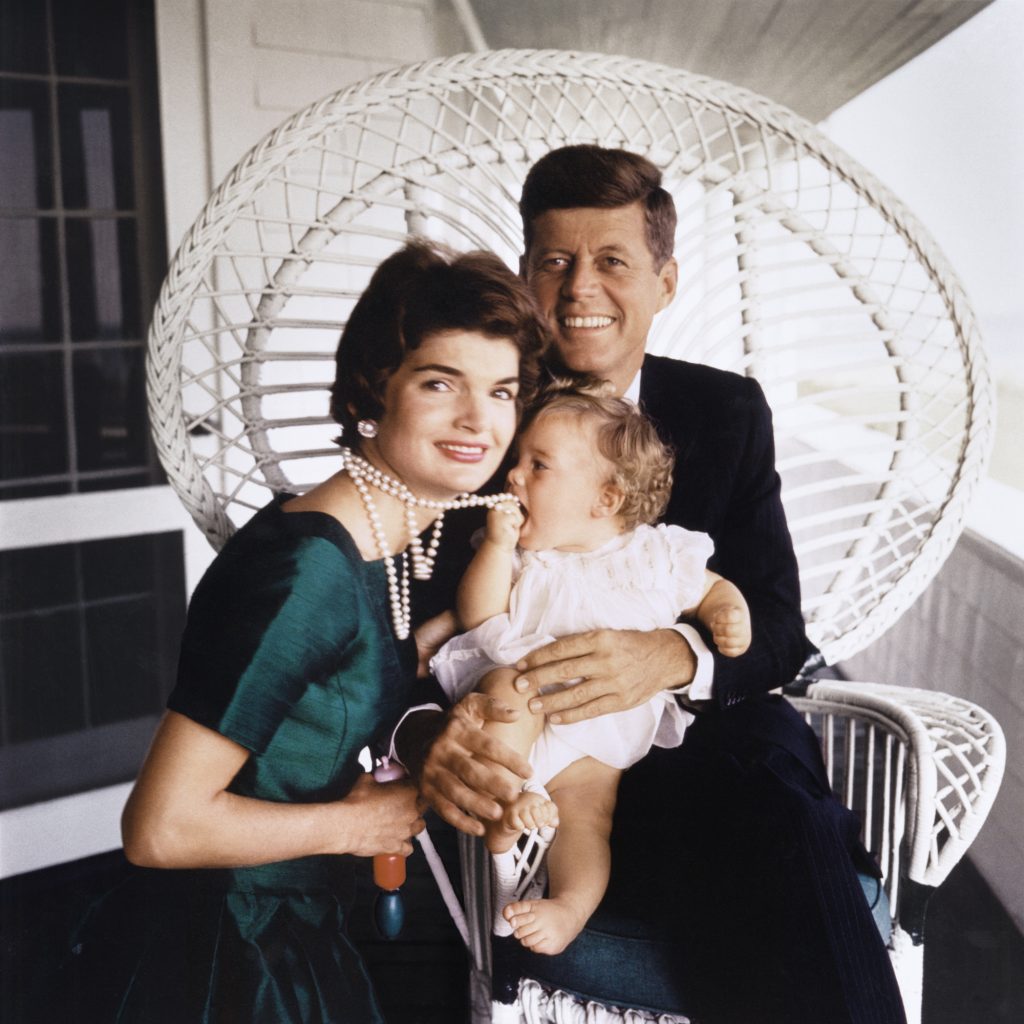 Caroline mouthing Jackie’s pearls while sitting on Kennedy’s lap -- This iconic image of John, Jacqueline and Caroline Kennedy was taken in July 1958 during Jacques Lowe’s first photo shoot at the Kennedy family compound in Hyannis Port, Mass. (Photo Credit: Estate of Jacques Lowe)