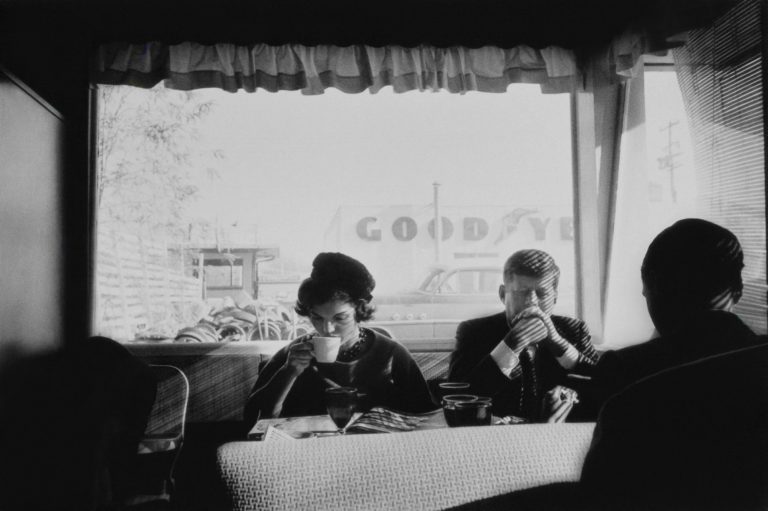 John and Jackie Kennedy sitting at restaurant -- John and Jacqueline Kennedy sit unrecognized in an Oregon diner during an early presidential campaign stop in the fall of 1959. Photo Credit: Estate of Jacques Lowe